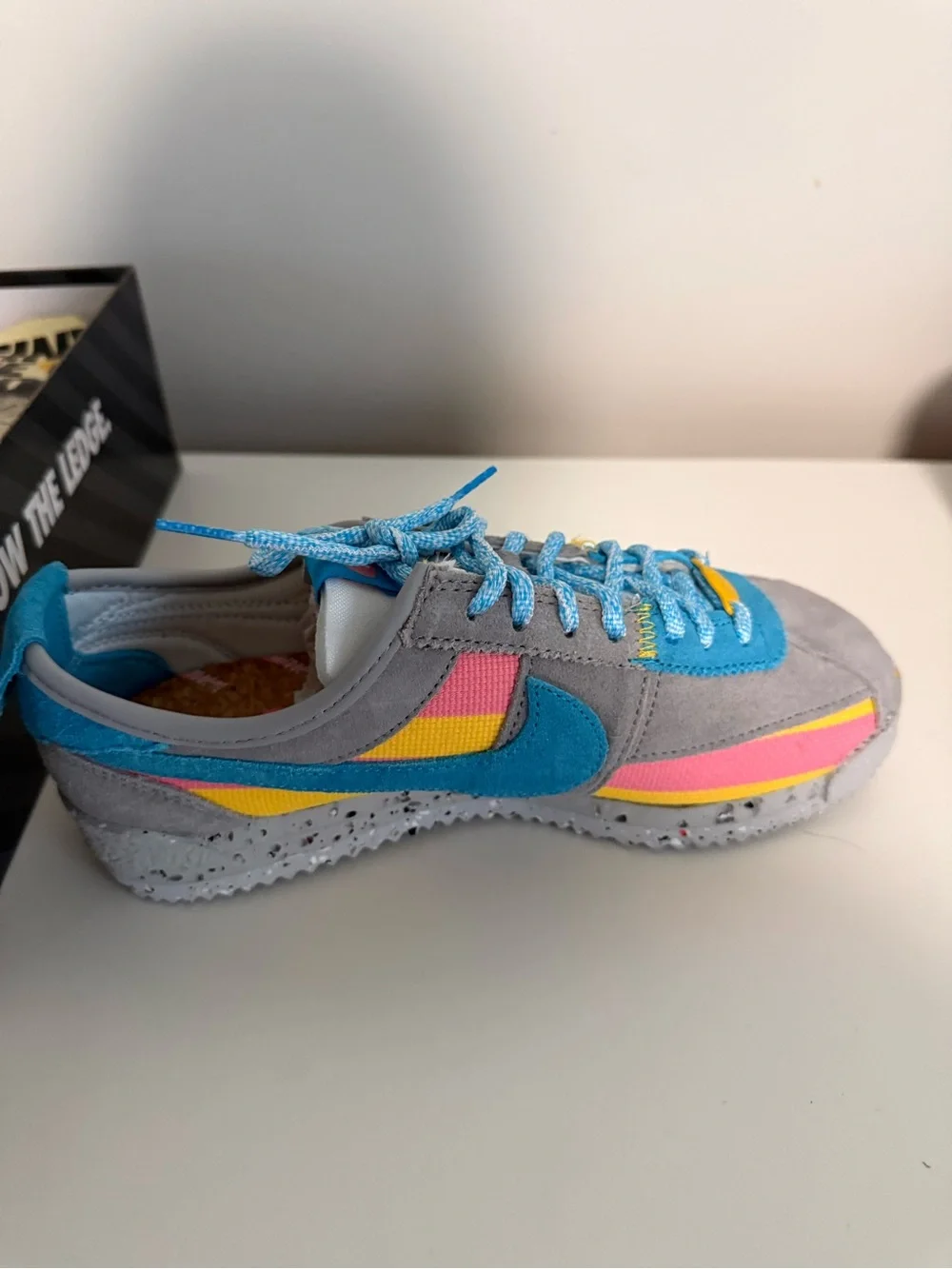 Nike Women's Gray Sneakers with Blue, Pink & Yellow Accents